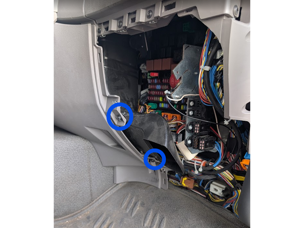 Unclip and remove the 2 plastic rivets and remove the plastic air duct.