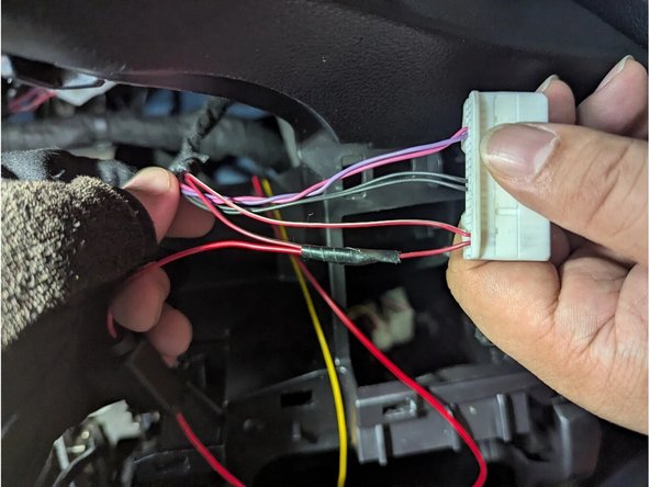 Strip a portion of the RED-WHITE wire (Pin 38) and connect the YELLOW wire (IGNITION). Solder for a secure connection. Insulate with electrical tape.