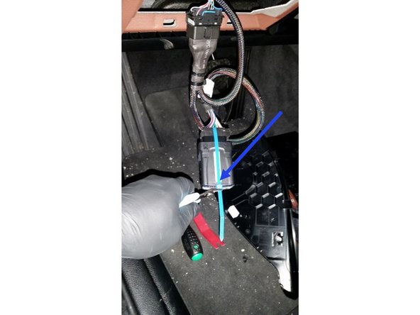 Plug the Geotab device into the harness, and secure with a cable tie as shown