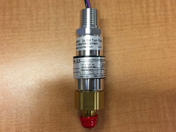 The sensor should provide a ground signal when the equipment is in its active state.