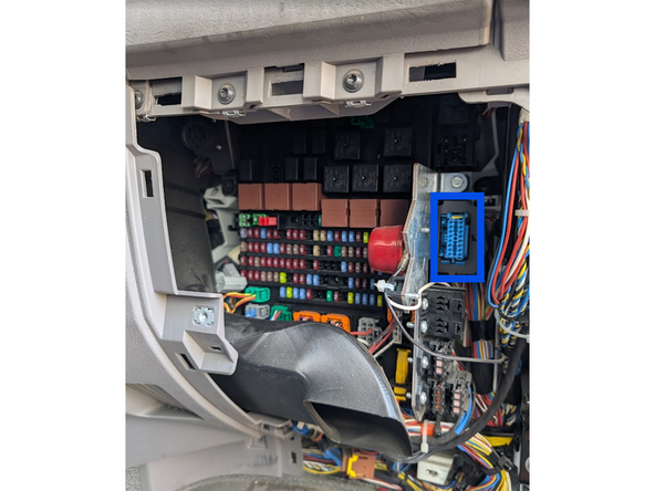 Unclip the OBD-port from its mounting bracket.