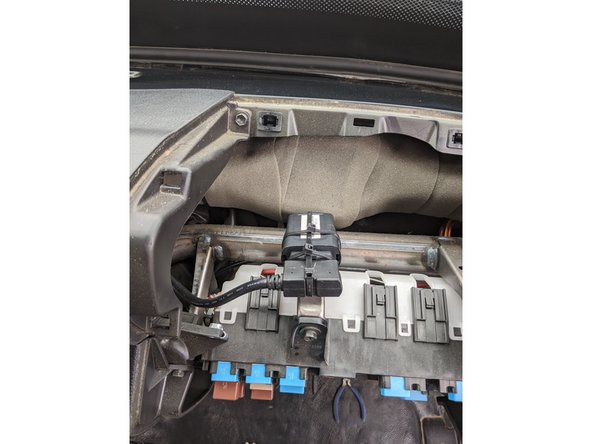 Using zip ties, securely mount the GO device to the factory dash bracket above the fuse box.