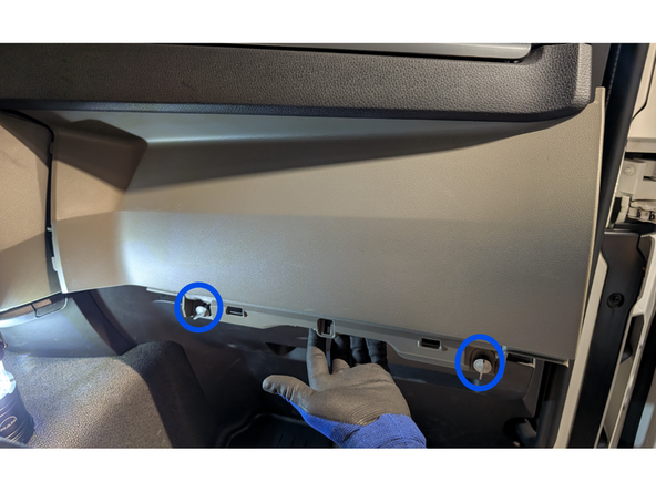 Unlock the two clips and remove the lower panel.