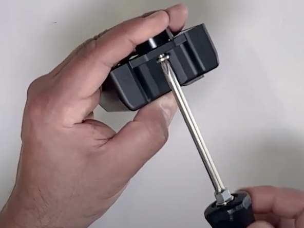 Fasten the 3 magnetic feet in place using the magnetic screws and install the magnet covers.