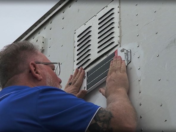 Align the device brackets with the previously drilled holes and press firmly for at least 60 seconds.