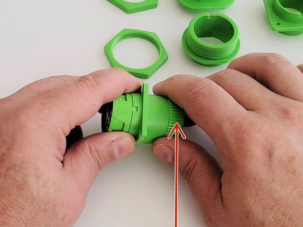Remove the screw cap at the back of the connector and slide it slightly away from the connector.