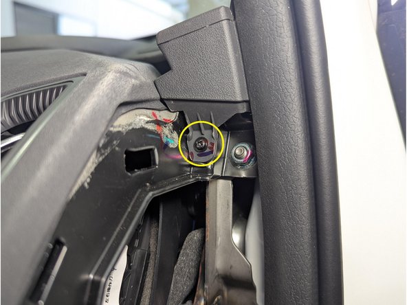 Remove the phillips screw (on both sides) using a screwdriver.