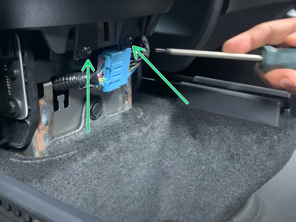 Refasten the two T20 TORX screws.