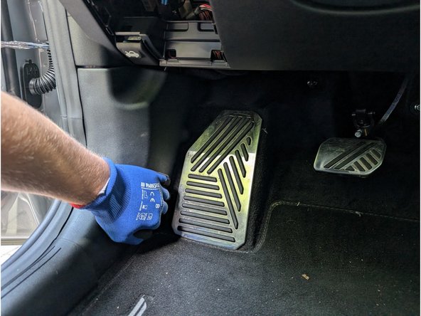 Pull the side trim panel outward to detach it