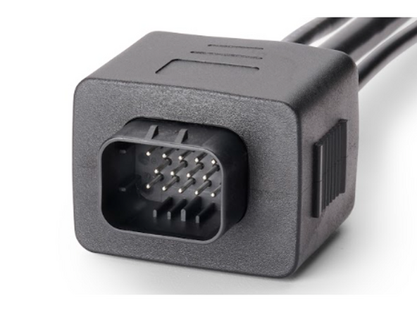 Plug the male 14-pin connector of the HRN-RCCCAAPX into the refrigeration unit's harness. Please note that the connector may vary slightly in appearance based on your specific harness version, as shown in the images below.