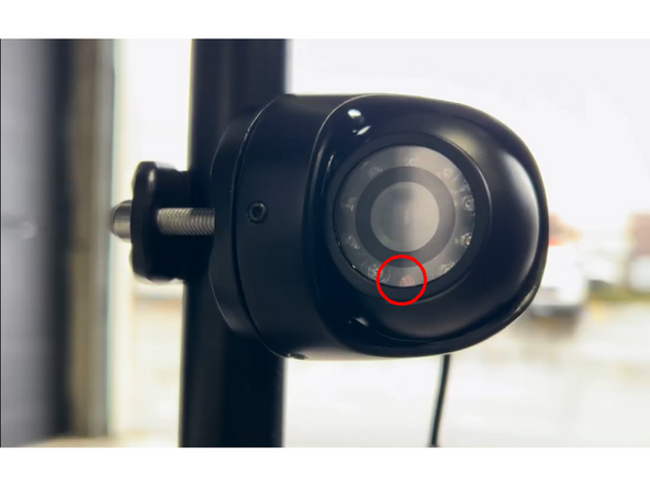 Loosen the allen screws around the camera body using an allen key to allow the camera to rotate freely within the bracket.