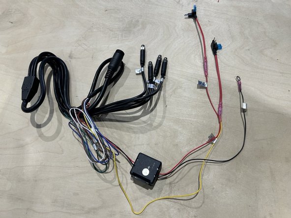 Prepare the monitor harness for power connections using Geotab's best practices.