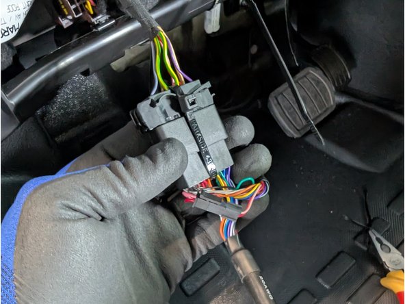 Plug the female connector from the T-harness into the OEM OBDII connector.