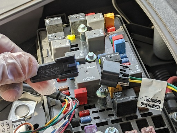 Locate the 2-pin J1939 connector in the fuse box and remove the EOL resistor.