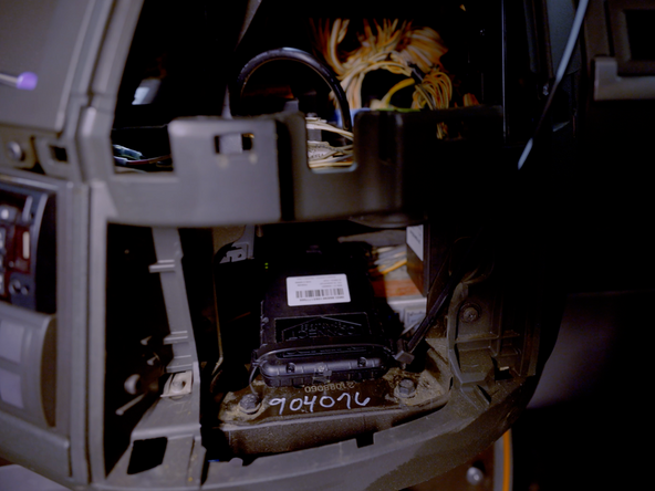 Find a suitable mounting location for the AssetTrac device.