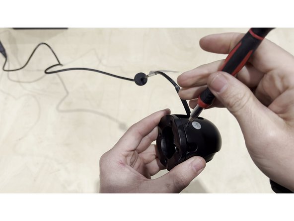 Before mounting, orient the camera so the sensor (lens) faces downward toward the ground.