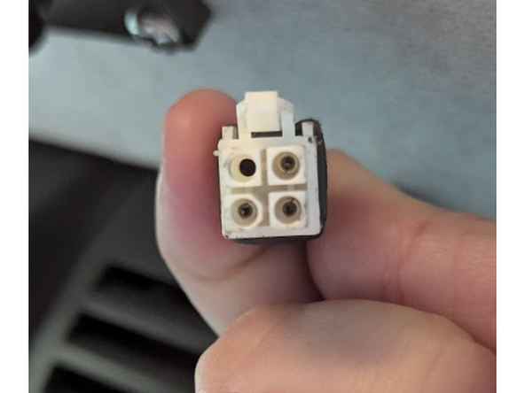 Unplug the in-cabin controller from its original vehicle-connected harness.