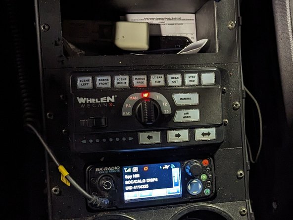 Use a T20 TORX screwdriver to remove the two screws, as shown.