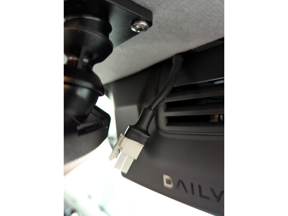 Unplug the in-cabin controller from its original vehicle-connected harness.