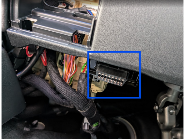 Detach the OBD II port from its original mounting position.