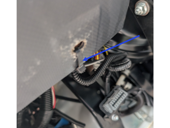 The panel is typically clipped in however, the bottom may be secured with a cable tie in place of a bolt or clip.