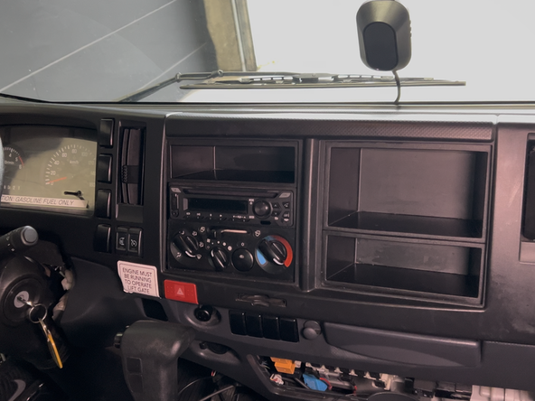Determine the ideal mounting location for the monitor inside the vehicle cab.