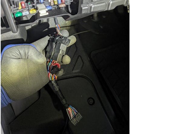 Plug the female connector from the T-harness into the OEM OBDII connector.