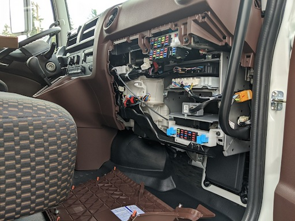 Remove the lower passenger-side dash panel. It is held in place by clips only.