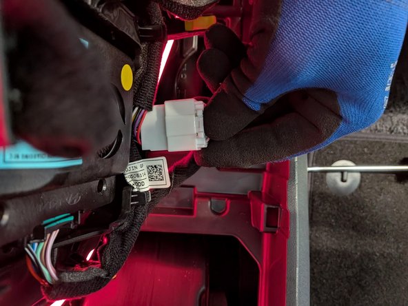 Disconnect the upper center-console cover assembly connector.