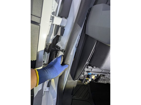 Remove the driver side door seal at the middle part.