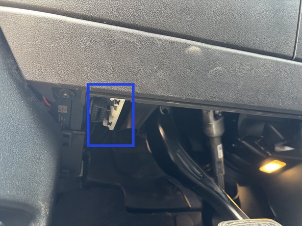 The OBD2 port is located below the steering column, on the lower left side of the dashboard.