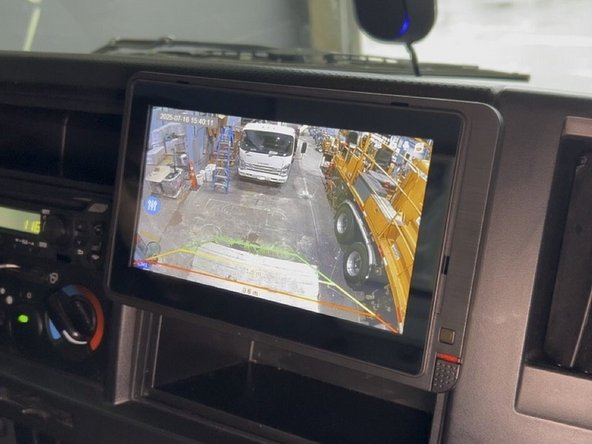 Locate the reverse trigger wire in the vehicle.