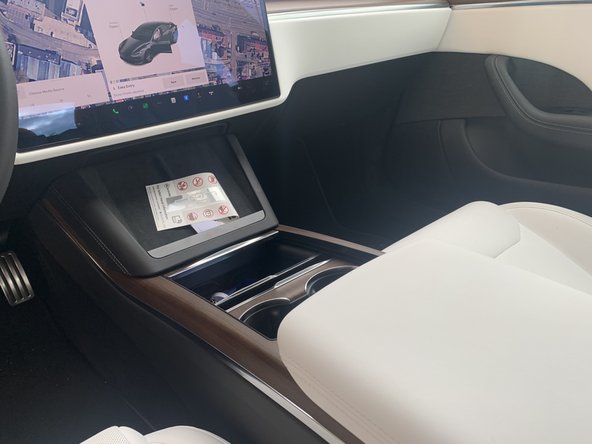 The Tesla connector is located below the touch screen in the centre console.