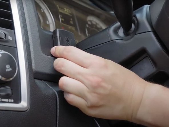 Mount the IOX-BT onto the adhesive tape and firmly hold it in place for 60 seconds.