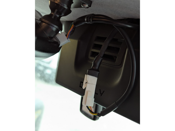 Connect the white HRN-CCCACIT male connector to the in-cab controller.