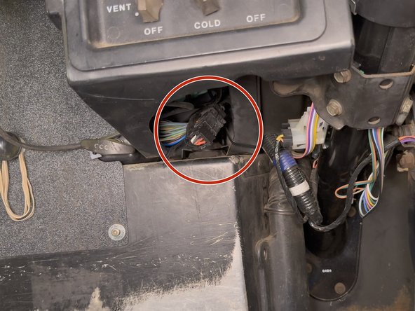 The ECM connector should be located to the left of the steering column.