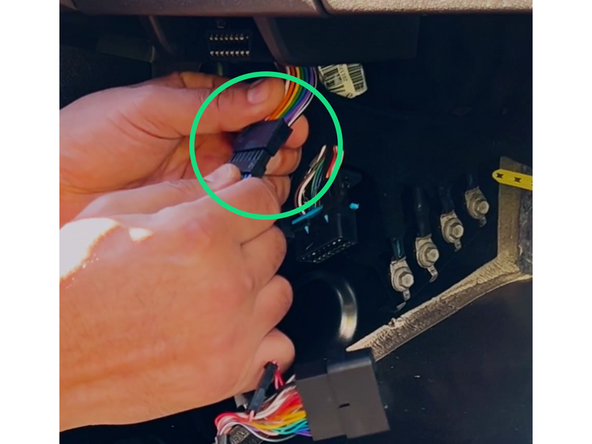 Attach the diagnostic port to the male end of the harness.  Ensure that it is locked into place.