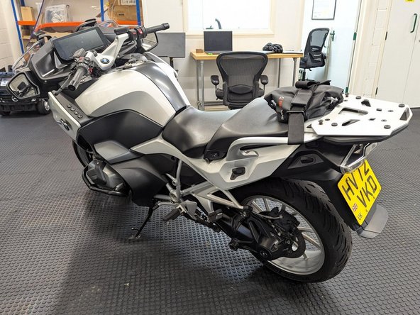 Replace all panels, seats, luggage rack / plate, connectors, screws, and clips in the reverse order they were removed.