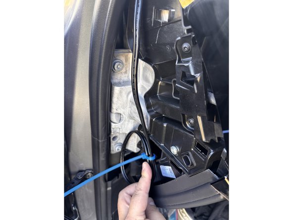 Continue routing the cable through the dash to reach the GO device.