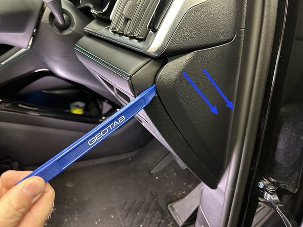 Pull the middle panel on the A-pillar using a panel removal tool.