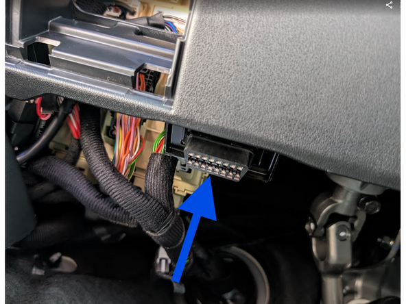 Clip the short section of the harness into place in the vehicle.