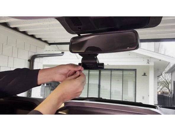 Remove the cable guard from the GO Focus Plus by loosening the screw on the side of the device.