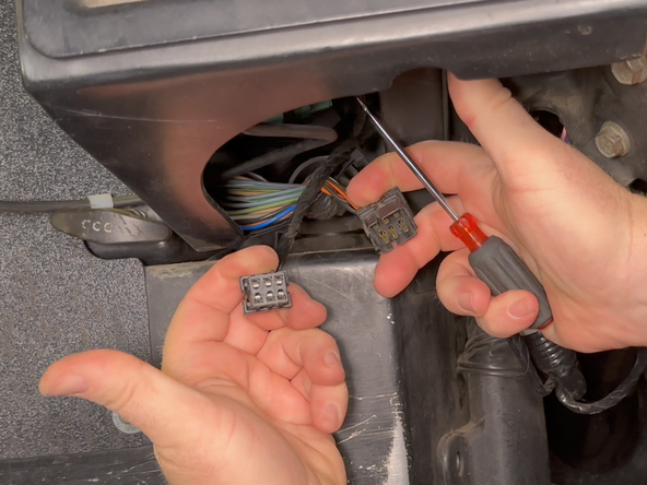 Pull the 2 connectors apart.