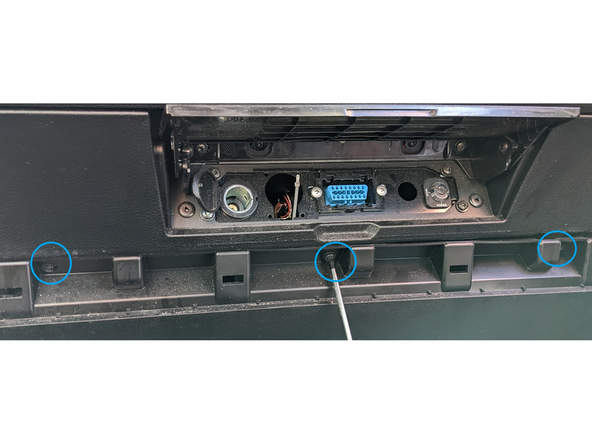 Use a size T20 Torx-driver to remove the three screws and remove the cover.