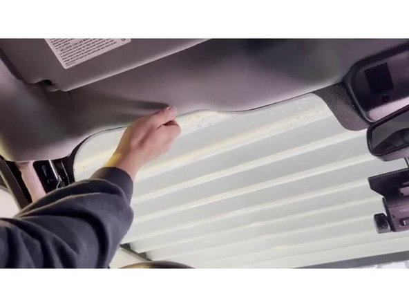 Use adhesive cable clips or sticky clips with zip ties to secure the cable along the route. Ensure the cable does not hang down or interfere with any vehicle controls, visors, or moving parts.