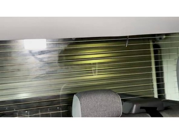 Leave enough slack at the rear window end to position and mount the camera without tension on the cable.