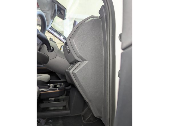 Using a plastic panel removal tool, detach the side-panels (on both sides) of the dashboard held by plastic fasteners.