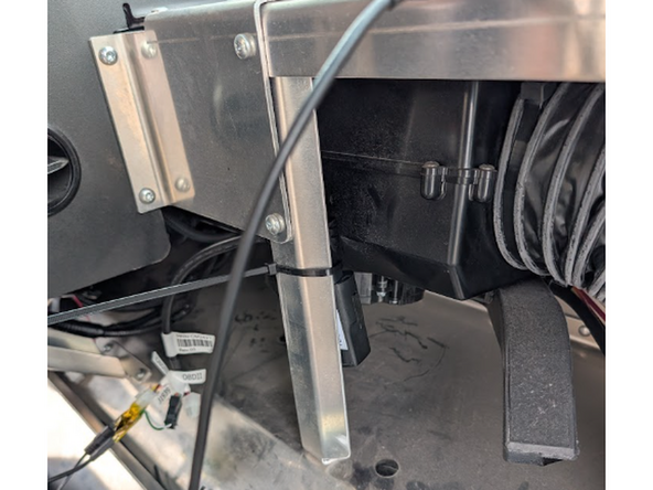 Secure go device to that vertical mount with 2 cable ties.  Ensure that the side with the barcode is facing away from the metal bracket.