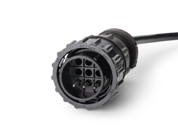 Connect the HRN-RCCTKTG4 harness to the 9-pin connector located on the back panel of the controller.