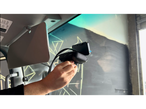 With the GO Focus Pro powered on and connected to the Geotab Video app, hold the camera in the desired mounting position on the windshield — within the wiper sweep area.